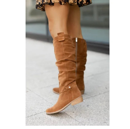 Brown suede knee-high boot with buckle strap, side profile