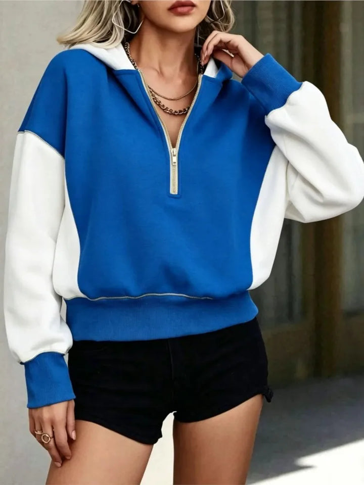 Blue and white colorblock quarter-zip hoodie, front view