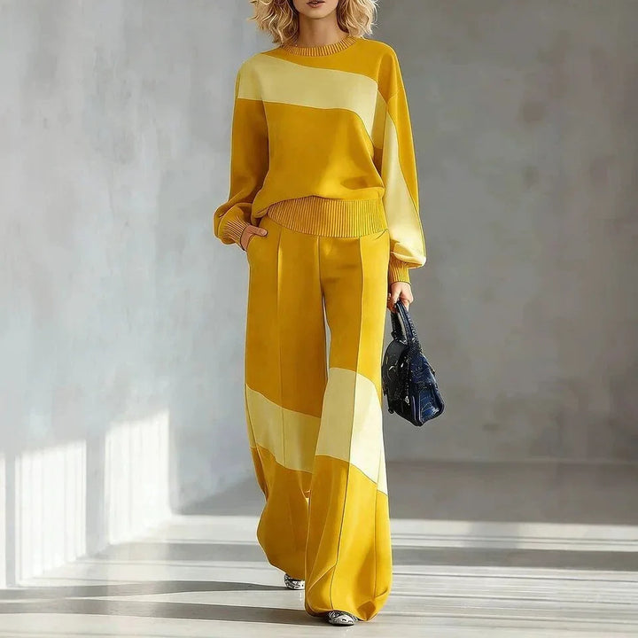 Woman wearing yellow color block sweater and wide leg pants set
