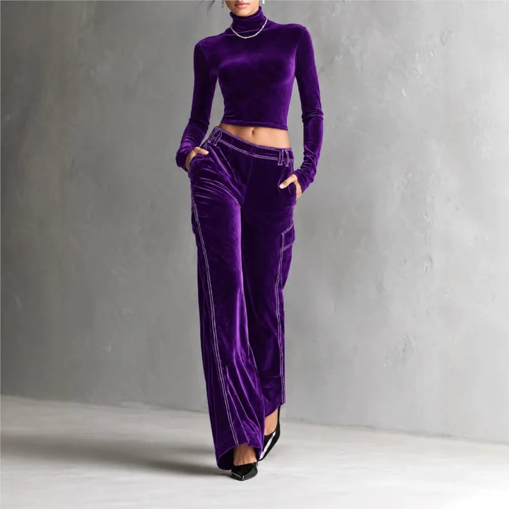Woman wearing purple velvet cropped turtleneck and wide leg cargo pants set