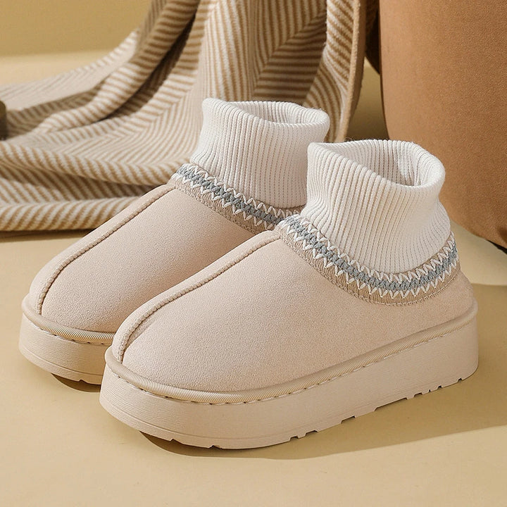 Beige plush ankle boots with ribbed knit collar, side view