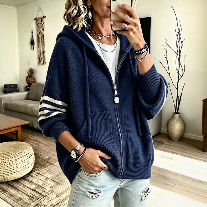 Navy blue zip-up hoodie with striped sleeve detail and front pockets