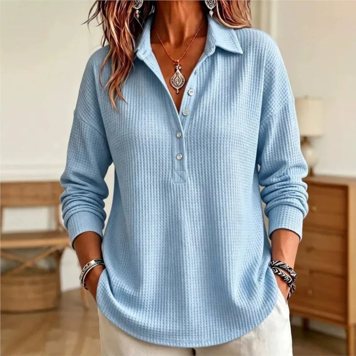 Blue waffle knit polo shirt with button placket, front view