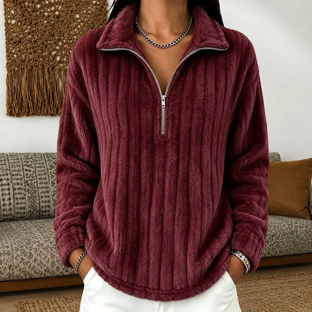 Woman wearing burgundy ribbed quarter-zip pullover