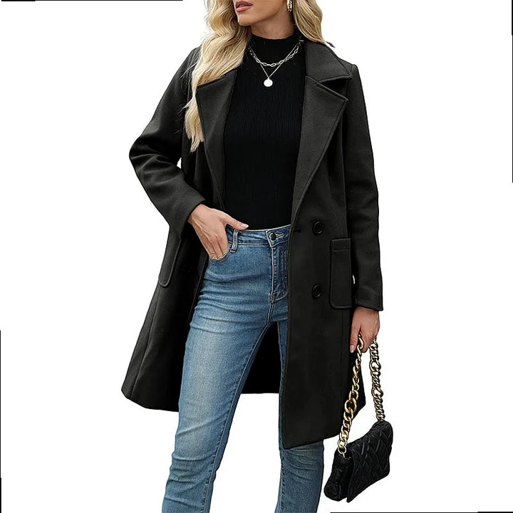 Woman wearing black double breasted wool coat