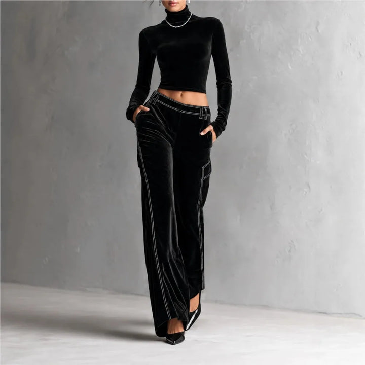 Woman wearing black velvet cropped turtleneck and wide leg cargo pants set