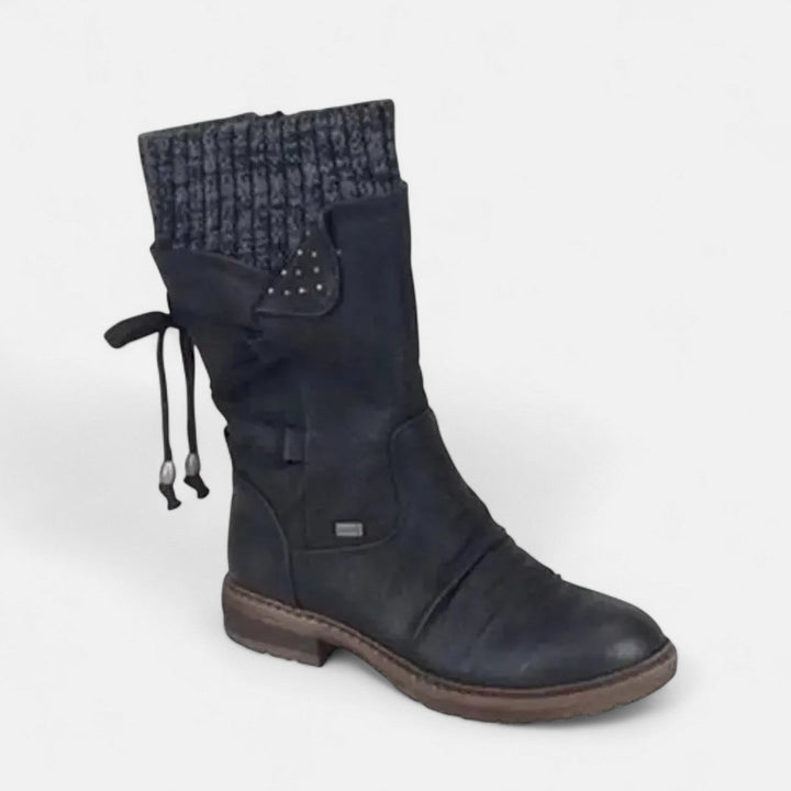 Black suede winter boot with knit cuff and lace up back detail