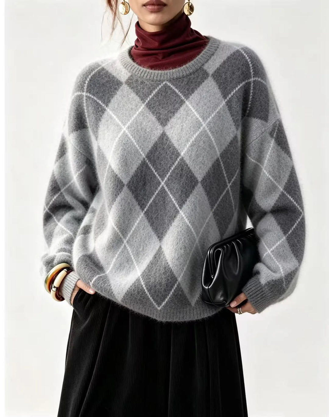Woman wearing gray argyle knit sweater with burgundy turtleneck