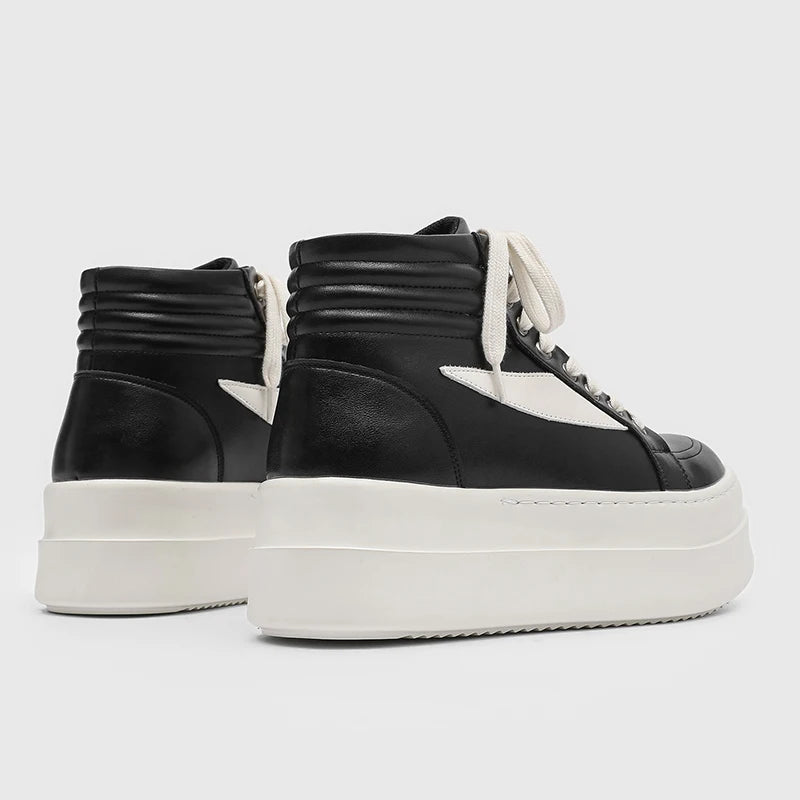 Back view of black and white high top platform sneakers