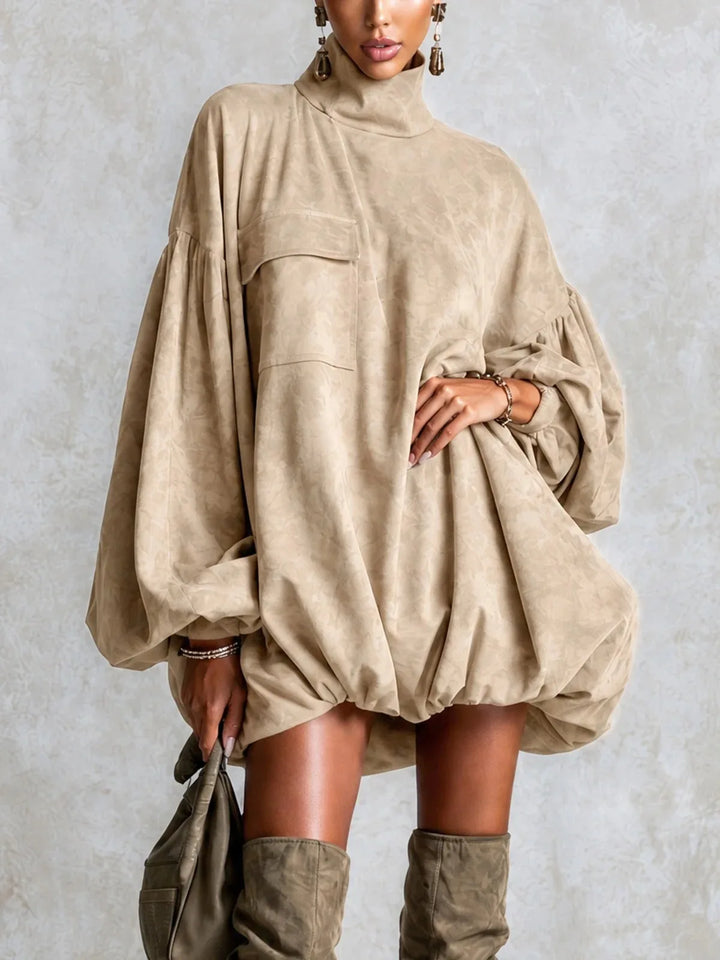 Woman wearing khaki turtleneck lantern sleeve mini dress, front view