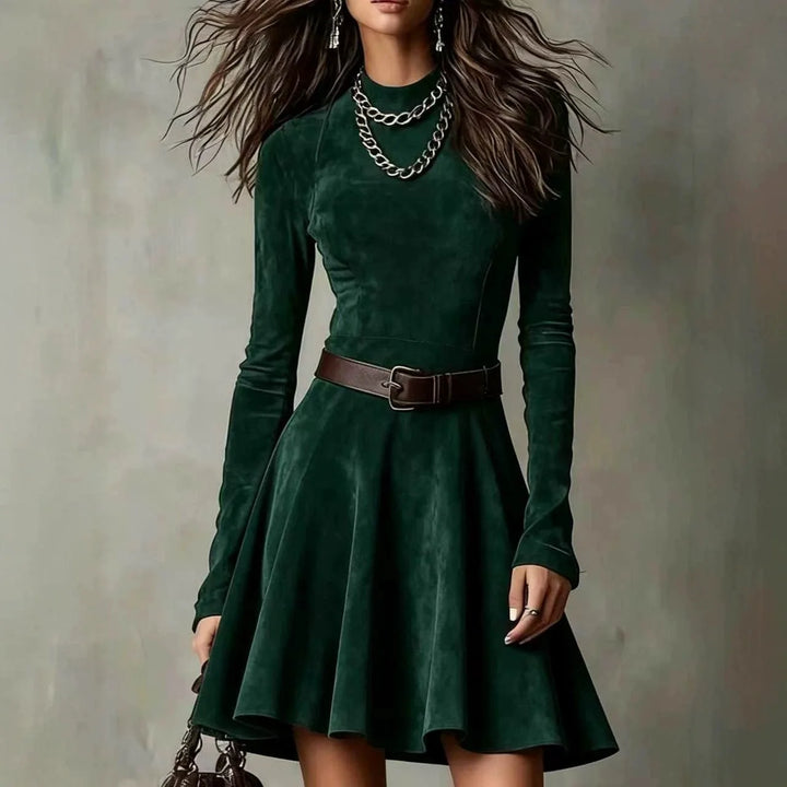Woman wearing dark green suede-look fit-and-flare mini dress with belt, front view