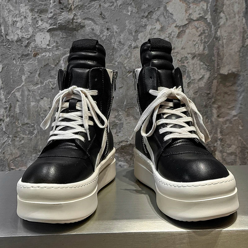 Black and white high top sneakers with platform sole, front view