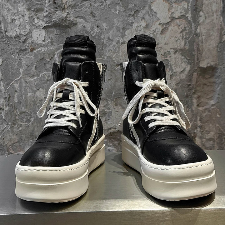Black and white high top sneakers with platform sole, front view