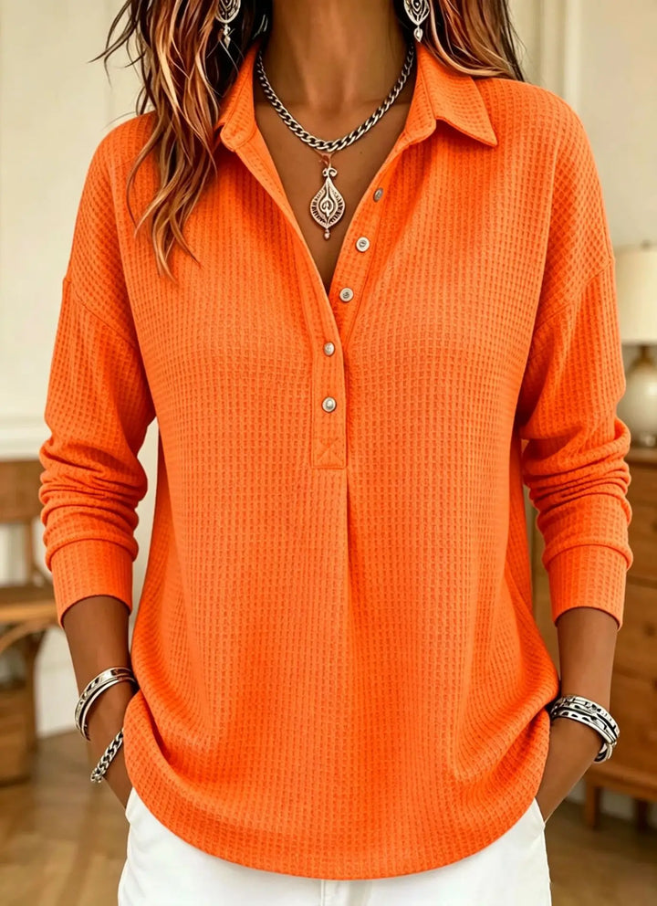 Orange waffle knit polo shirt with button placket, front view