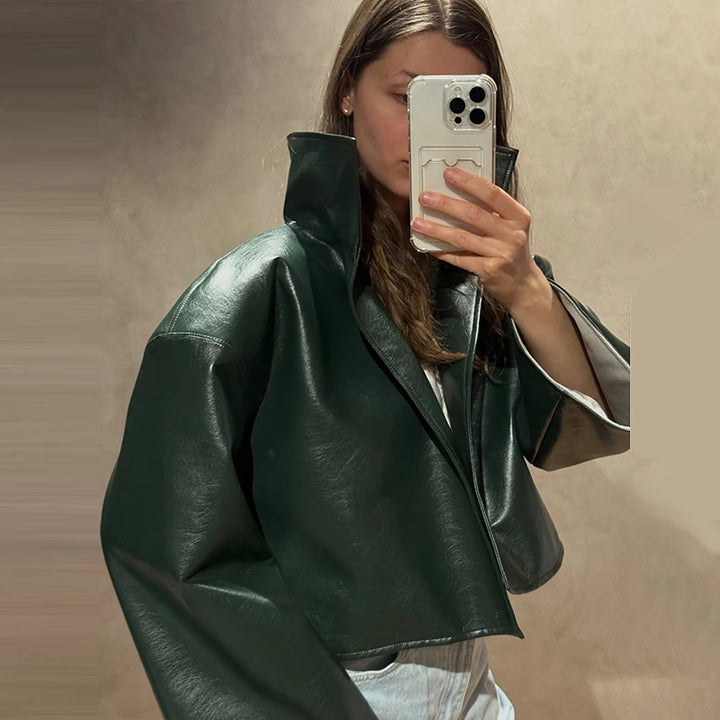 Green faux leather jacket with stand collar, side view