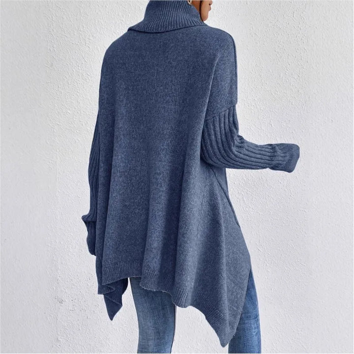 Navy blue turtleneck sweater shown from the back with asymmetric hem
