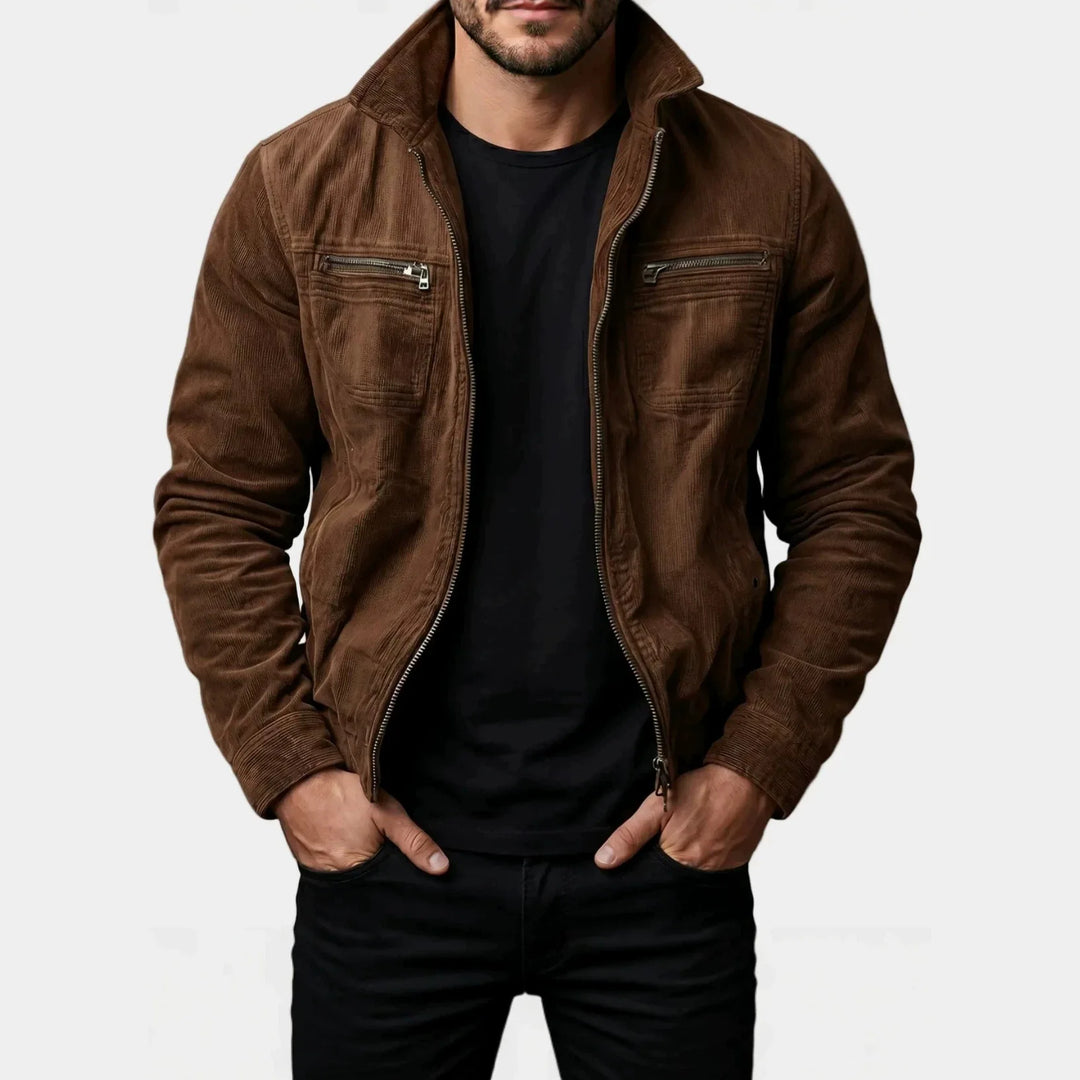Man wearing brown corduroy moto jacket, front view with hands in pockets