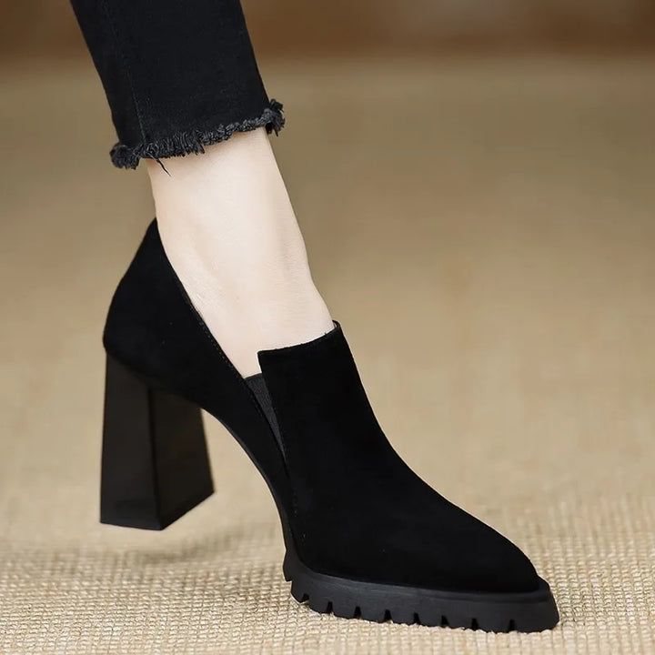 Black suede pointed toe pump, angled top view