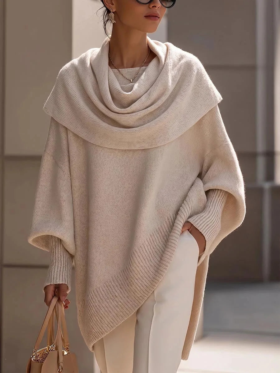 Woman wearing apricot draped scarf collar poncho sweater, front view