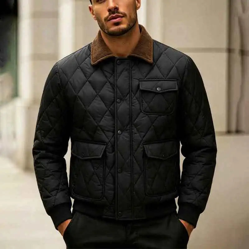Man wearing black quilted jacket with corduroy collar, front view