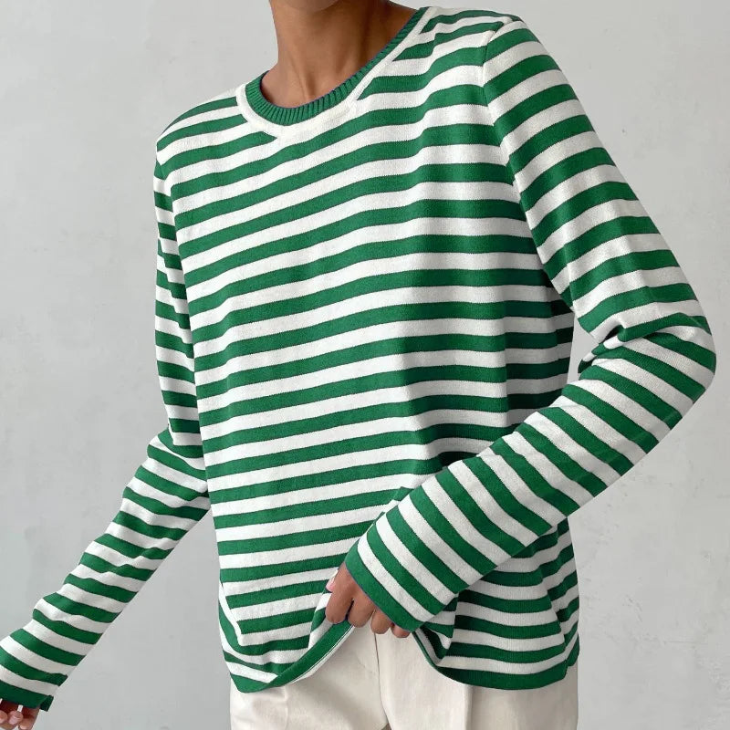Woman wearing green and white striped knit sweater