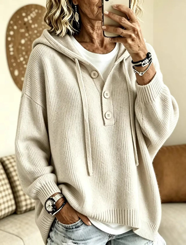 Woman wearing creamy-white button placket hooded sweater