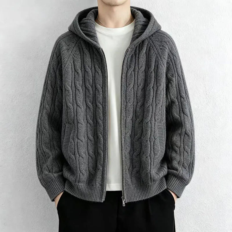 Man wearing dark grey cable knit hooded cardigan with front zip