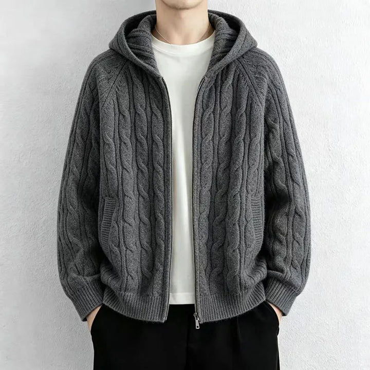 Man wearing dark grey cable knit hooded cardigan with front zip