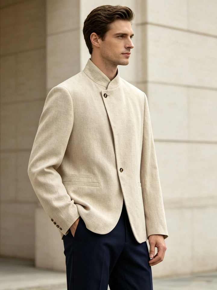 Side view of beige mandarin collar blazer with navy trousers