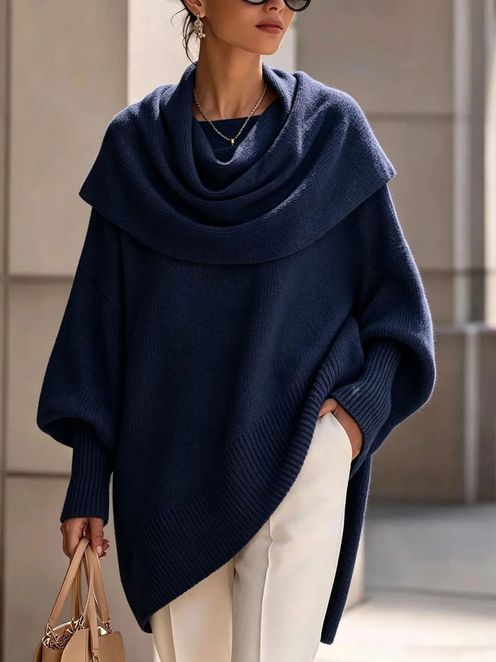 Woman wearing navy blue draped scarf collar poncho sweater