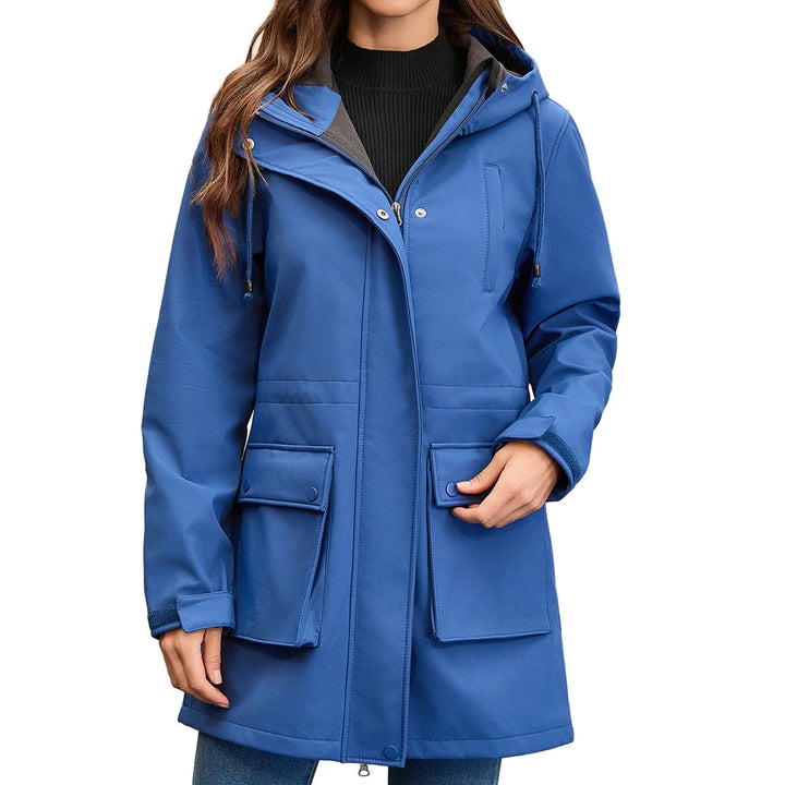 Woman wearing blue hooded rain jacket, front view