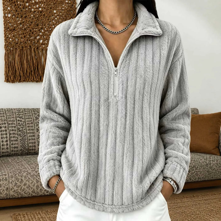 Woman wearing gray ribbed quarter-zip pullover