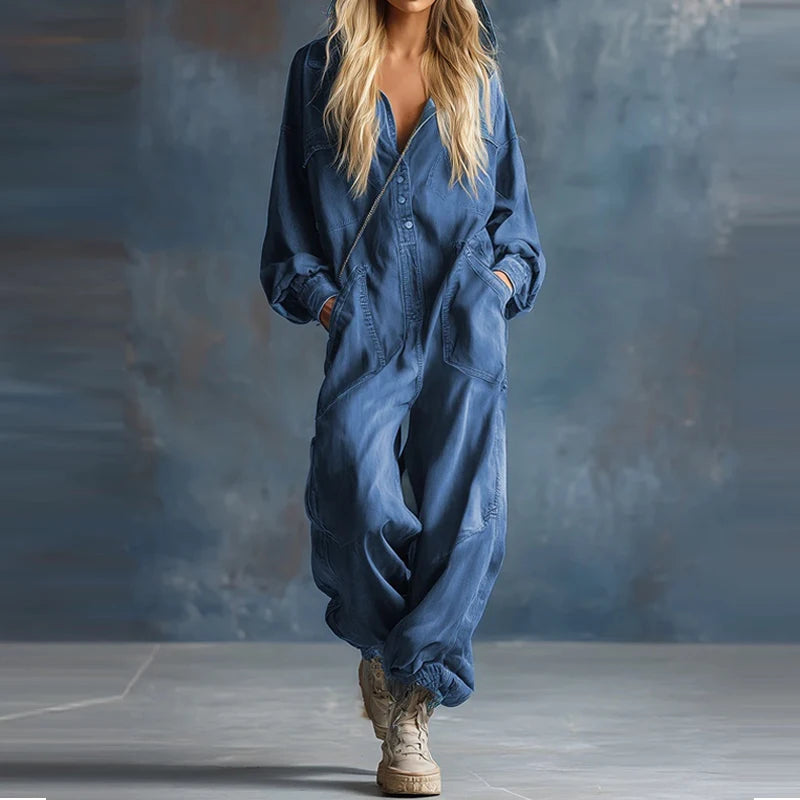 Blue denim hooded jumpsuit with patch pockets, walking pose