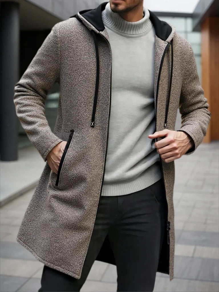 Man wearing coffee brown hooded mid-length fleece jacket with zipper pockets