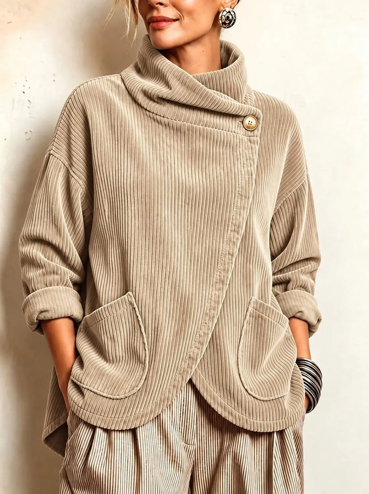 Woman wearing khaki corduroy jacket with cowl collar and patch pockets