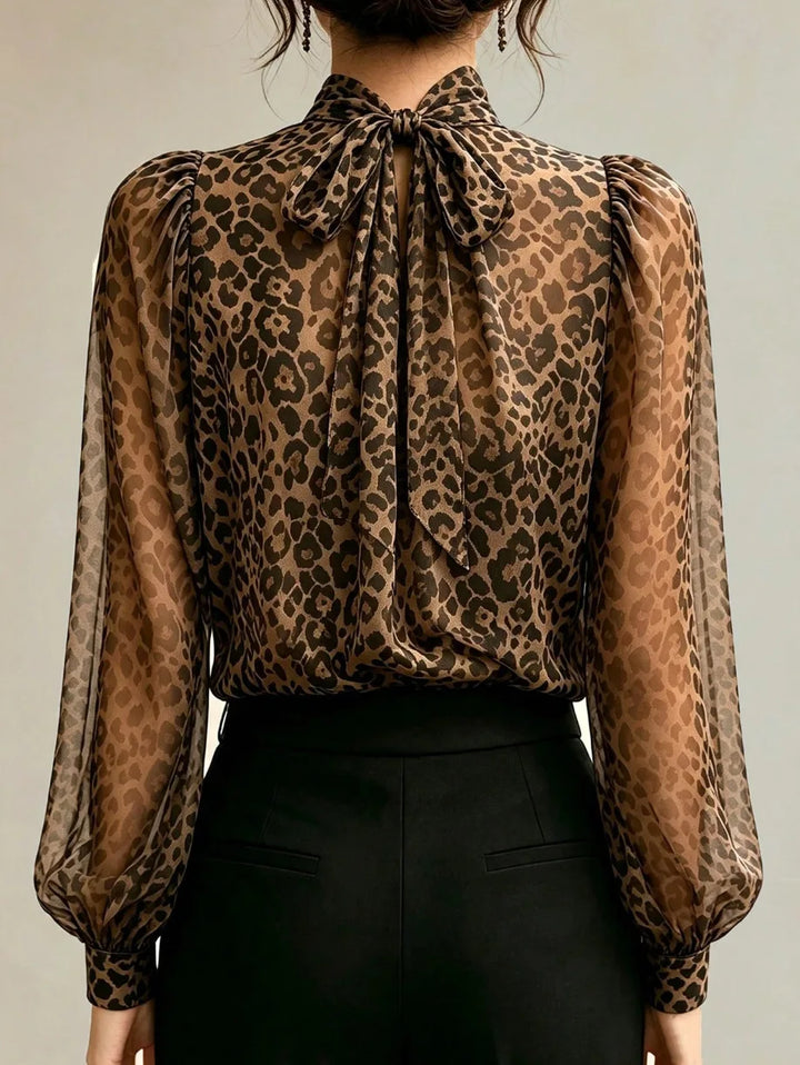 Back view of leopard print blouse showing tie bow closure at neck