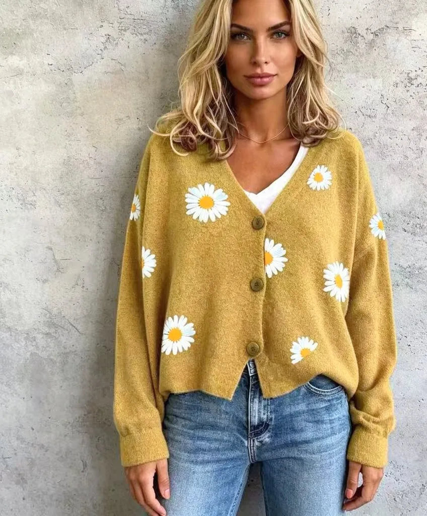Close up of ginger yellow daisy embroidered cardigan front
