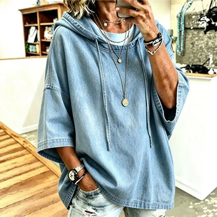 Light blue denim hoodie with dropped shoulders and drawstring