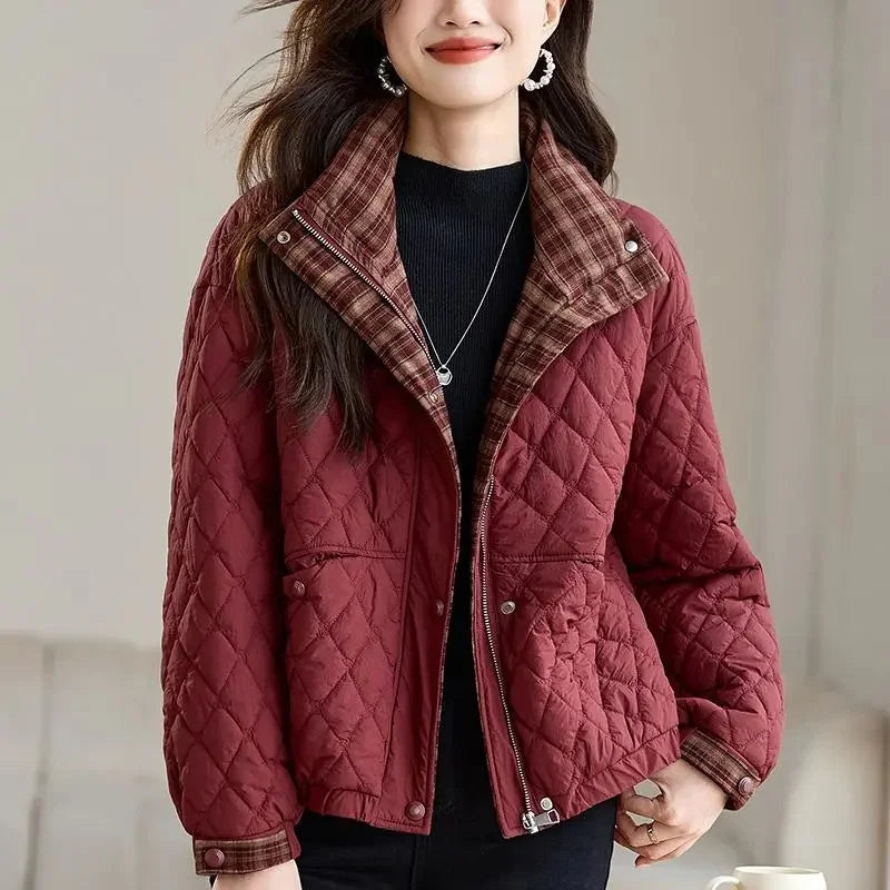 Woman wearing wine red quilted puffer jacket with plaid collar