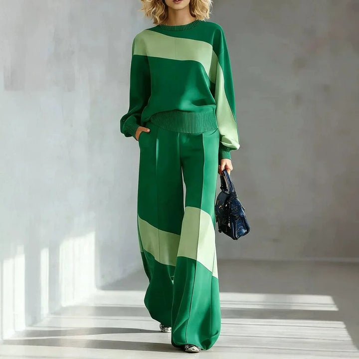 Woman wearing green color block sweater and wide leg pants set