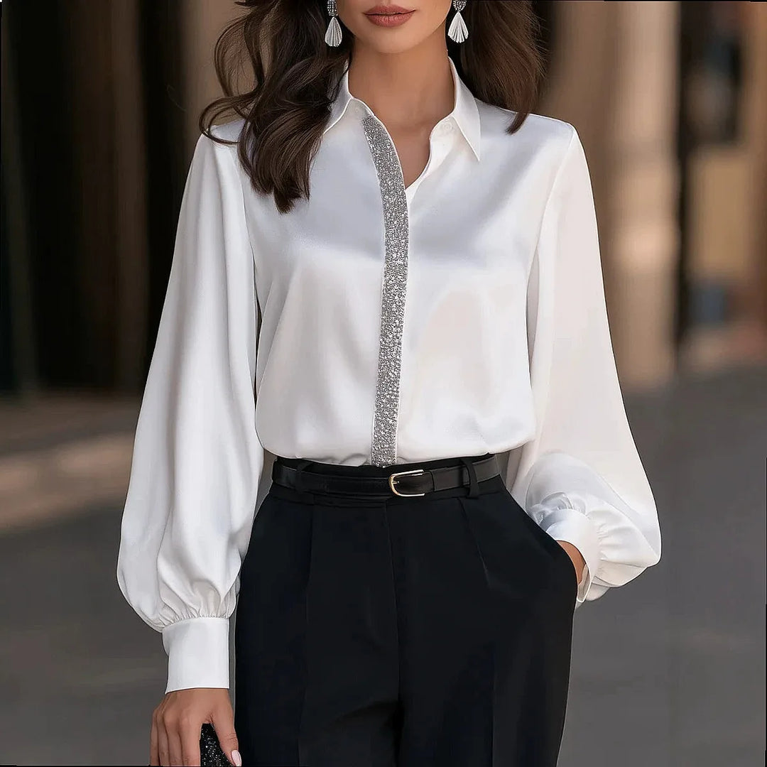 Woman wearing white satin blouse with lantern sleeves