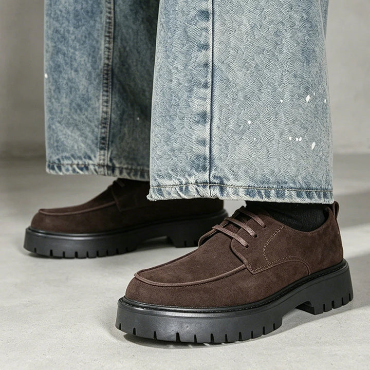 Man wearing brown suede platform oxford shoes with jeans
