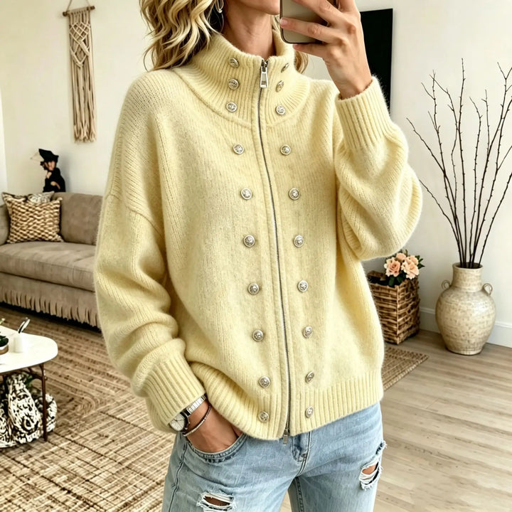 Woman wearing yellow stand collar zip cardigan with button details
