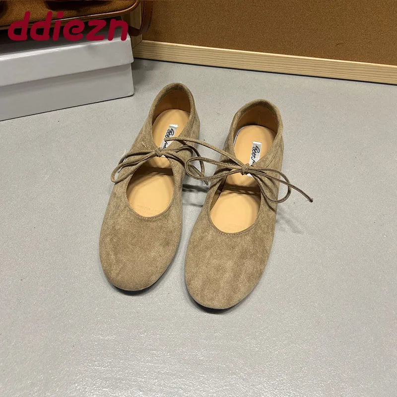 Apricot suede-look ballet flats with butterfly-knot ties, front view