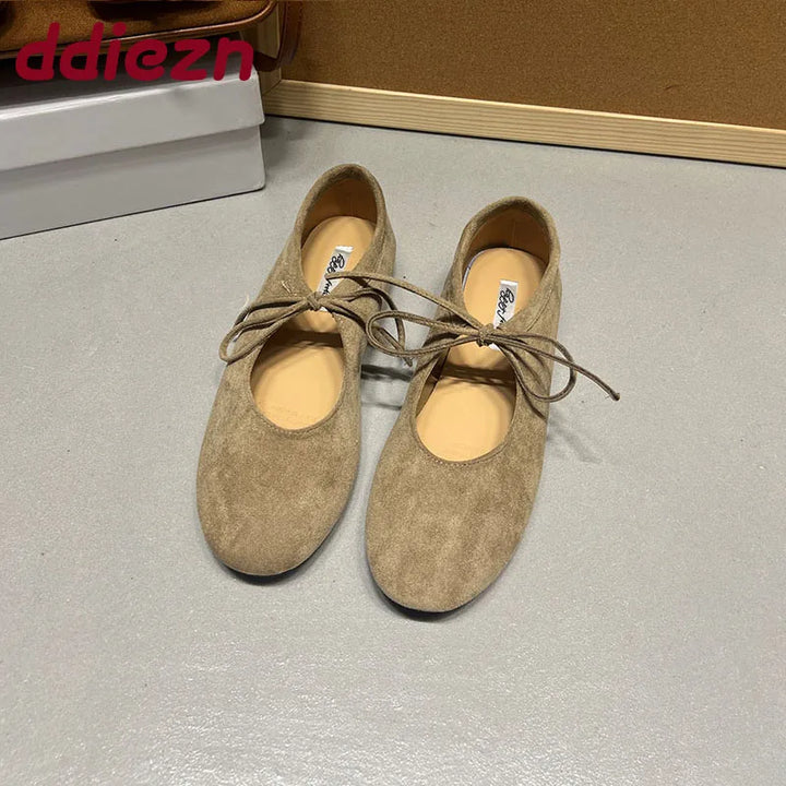Apricot suede-look ballet flats with butterfly-knot ties, front view