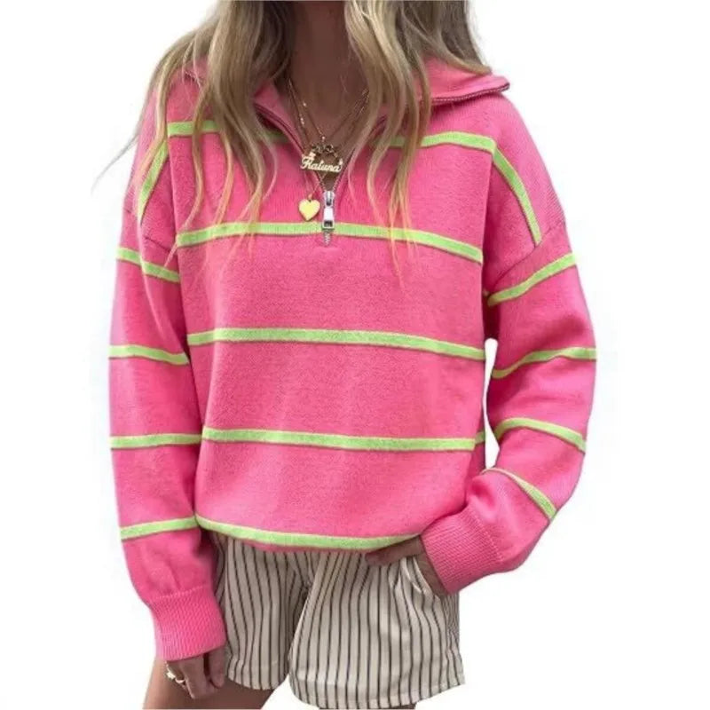 Woman wearing pink and green striped quarter-zip sweater, close view