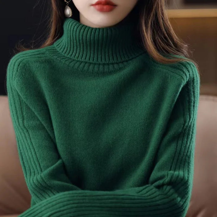 Green ribbed turtleneck knit sweater, close-up front view