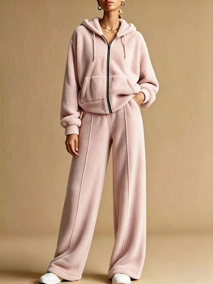 Woman wearing pink sherpa zip hoodie and wide leg pants set