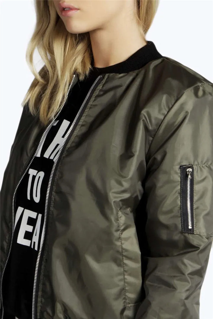 Close up of green bomber jacket sleeve zip pocket and collar