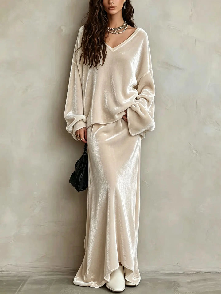 Close up of apricot velvet V neck pullover and maxi skirt set